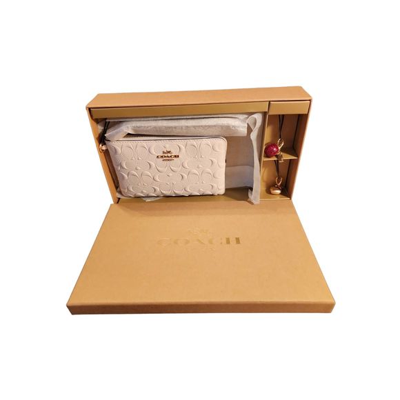 Coach Handbags - NWT Coach Wristlet White Leather Logo Design with Charms and Gift Box